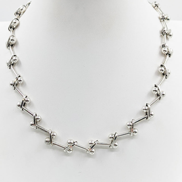 Interlinked silver ball and bar necklace