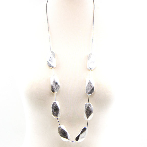 Long burnished silver necklace with facetted beads