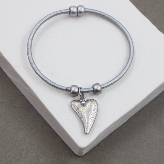 Heart charm on leather bracelet with magnetic clasp